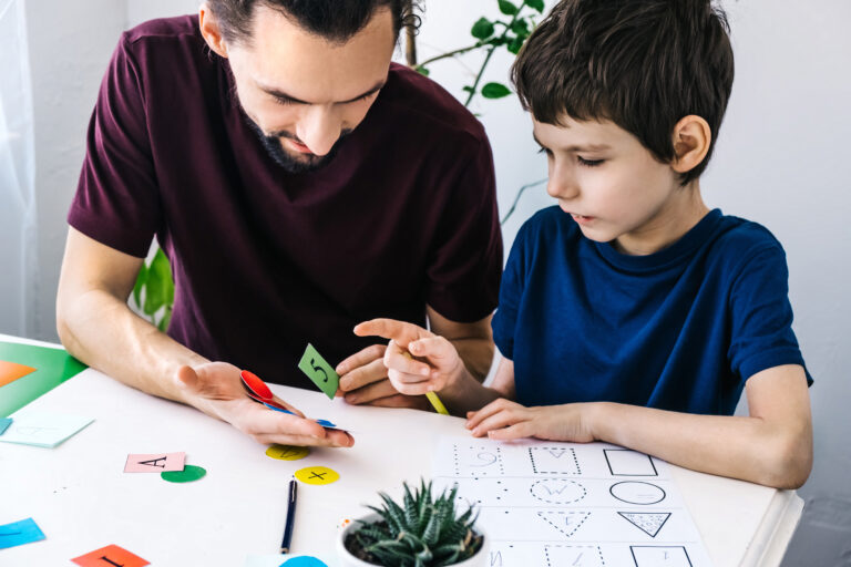 young boy learning with mftc carer